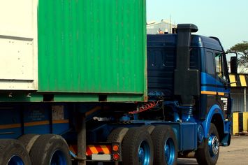 storage container being delivered on truck