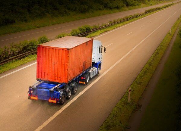 storage container, being delivered on flatbed truck and trailer storage container, being delivered on flatbed truck and trailer
